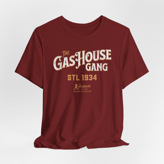 A maroon short-sleeve t-shirt with a vintage-style graphic print reading 'The Gas House Gang STL 1934' and a small 'Artifacts Collection' logo.