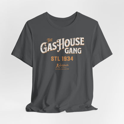 An asphalt grey short-sleeve t-shirt with a vintage-style graphic print reading 'The Gas House Gang STL 1934' and a small 'Artifacts Collection' logo.