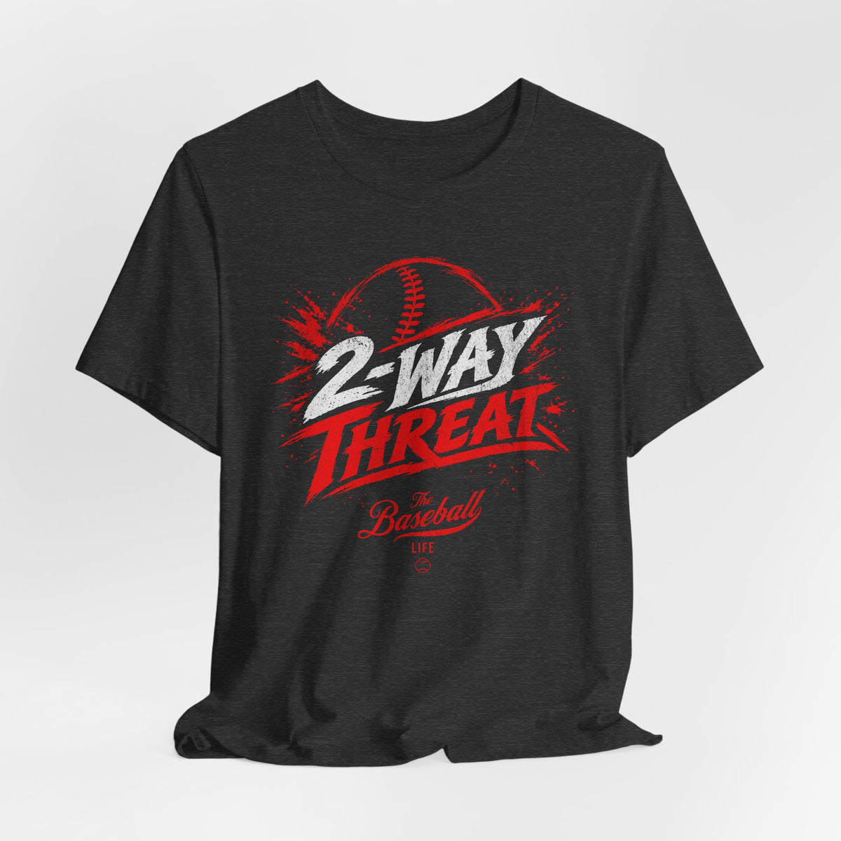A dark grey heather baseball t-shirt featuring a high-energy "2-WAY THREAT" graphic with The Baseball Life logo.