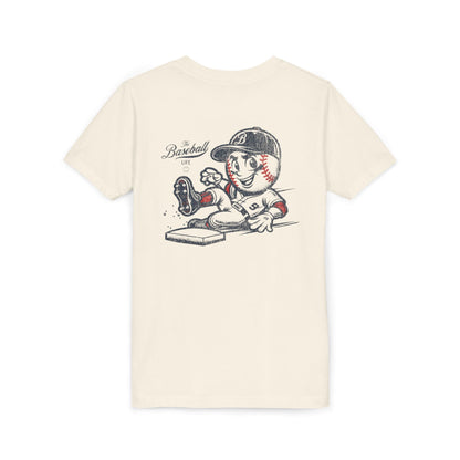 An off-white natural t-shirt with a baseball mascot wearing a baseball uniform sliding into a base, kicking up dirt.