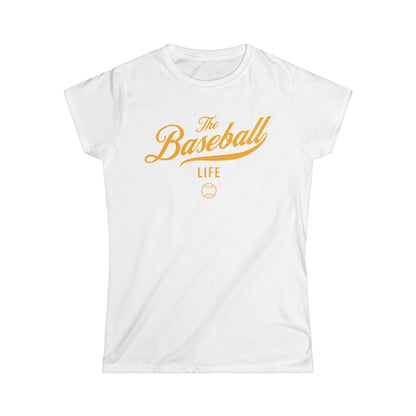A women's white cap-sleeve crewneck t-shirt with a yellow gold logo graphic on the front reading 'The Baseball Life' and a small baseball icon, displayed on a solid white background.