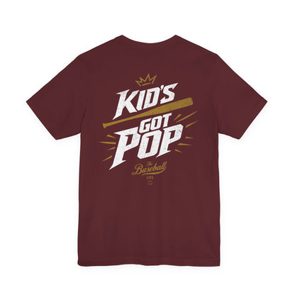 The back of a maroon baseball t-shirt with the slogan Kid's Got Pop and a baseball bat graphic.