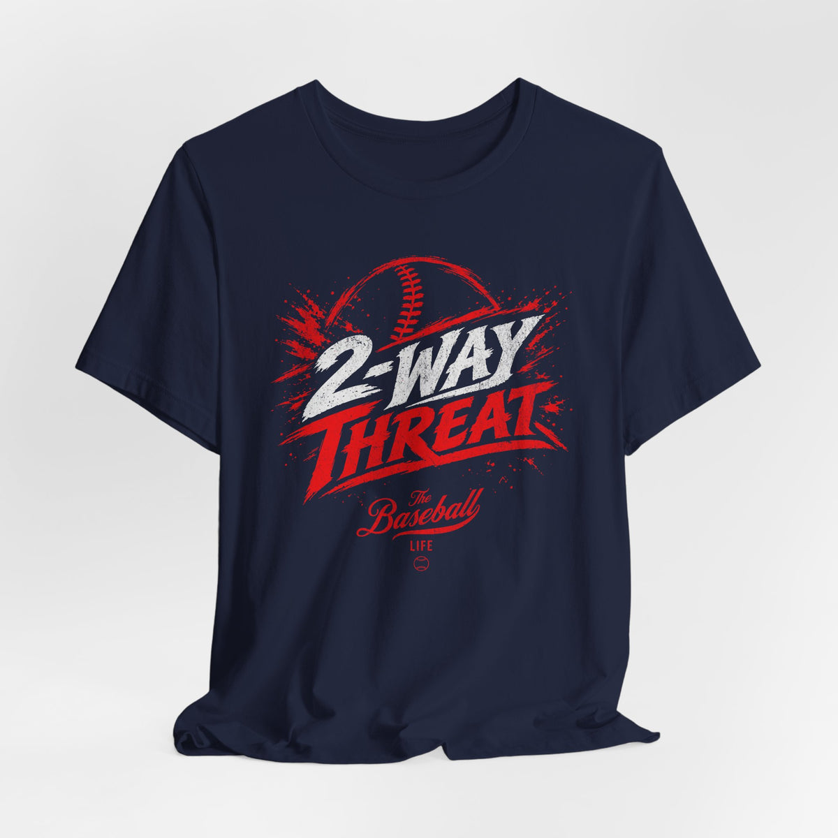 A navy baseball t-shirt featuring a high-energy "2-WAY THREAT" graphic with The Baseball Life logo.