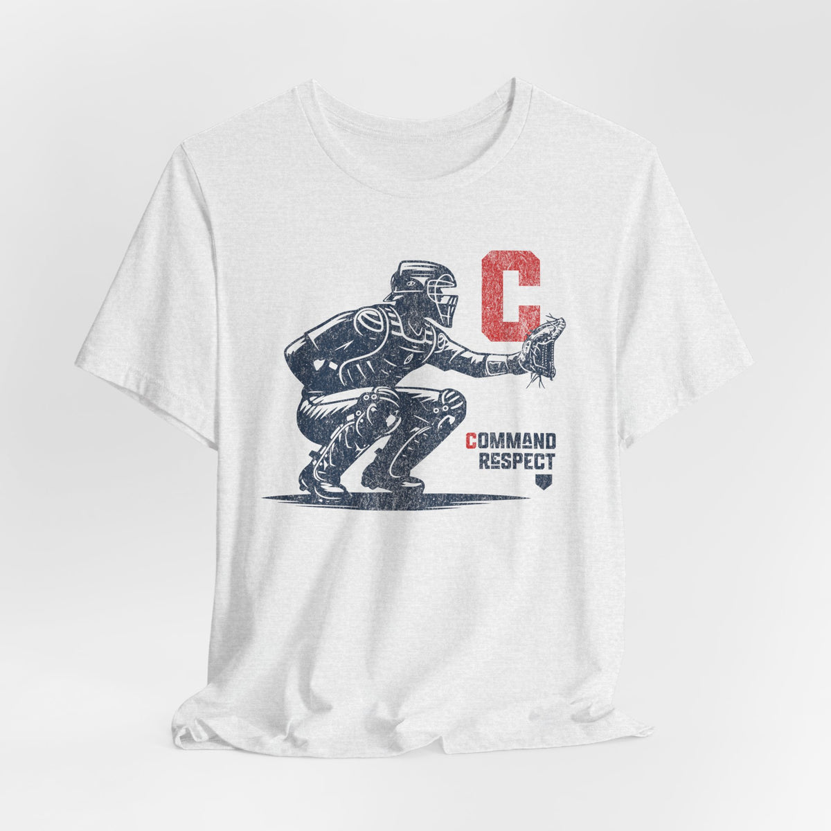 A white t-shirt featuring a baseball catcher and the words COMMAND RESPECT in navy, and a red letter C.