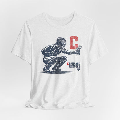 A white t-shirt featuring a baseball catcher and the words COMMAND RESPECT in navy, and a red letter C.