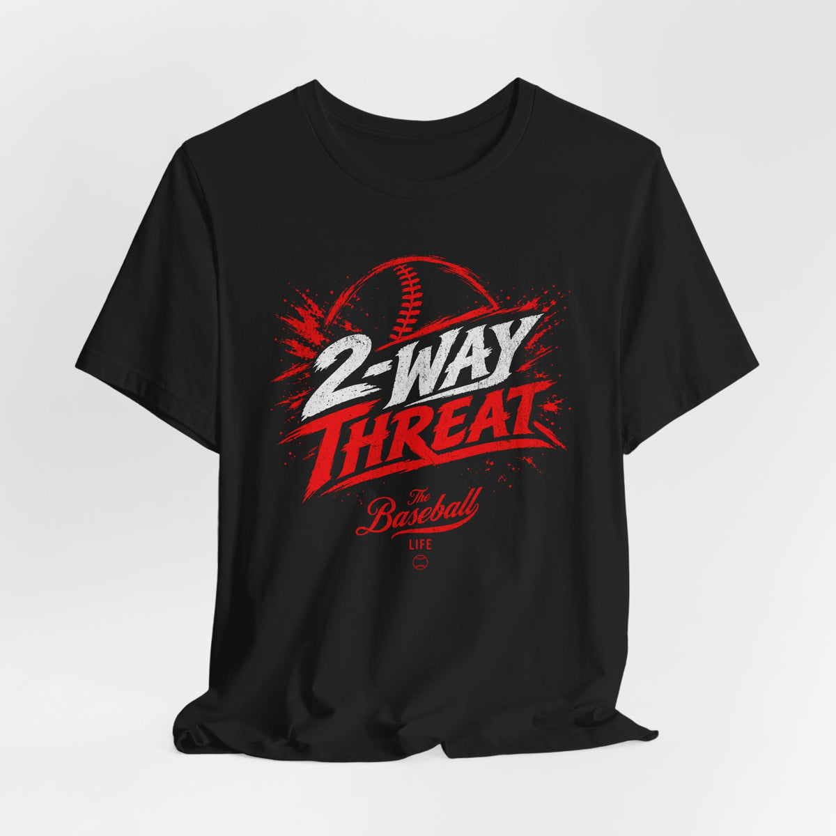 A black baseball t-shirt featuring a high-energy "2-WAY THREAT" graphic with The Baseball Life logo.