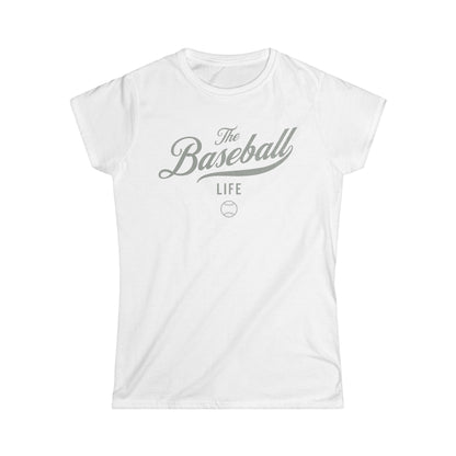A women's white cap-sleeve t-shirt with a silver gray The Baseball Life logo printed across the chest.