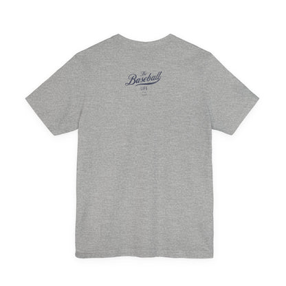 An athletic heather grey t-shirt shown from the back featuring The Baseball Life logo.
