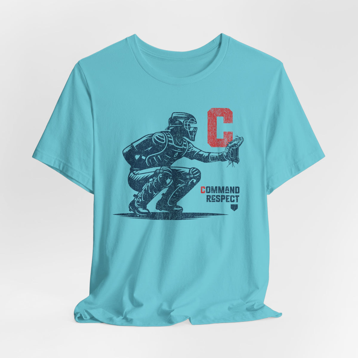 A turquoise t-shirt featuring a baseball catcher and the words COMMAND RESPECT in navy, and a red letter C.