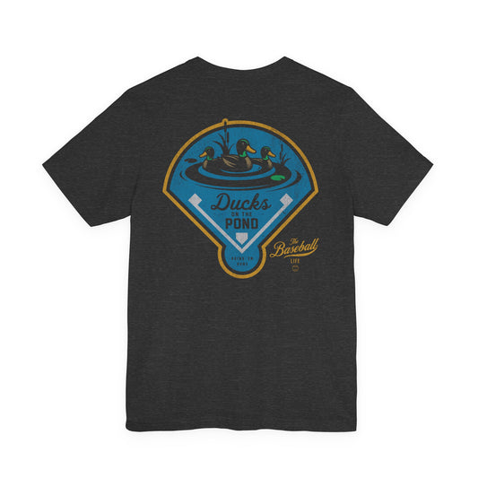 The back of a dark grey heather baseball t-shirt featuring a "Ducks on the Pond" graphic with The Baseball Life logo.