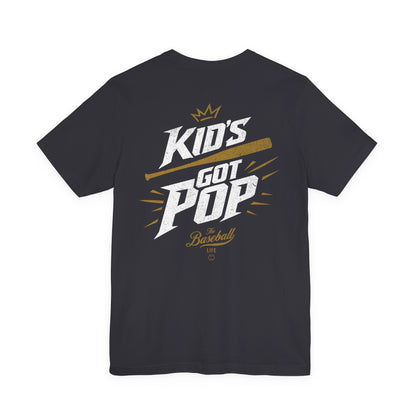 The back of a dark grey baseball t-shirt with the slogan Kid's Got Pop and a baseball bat graphic.
