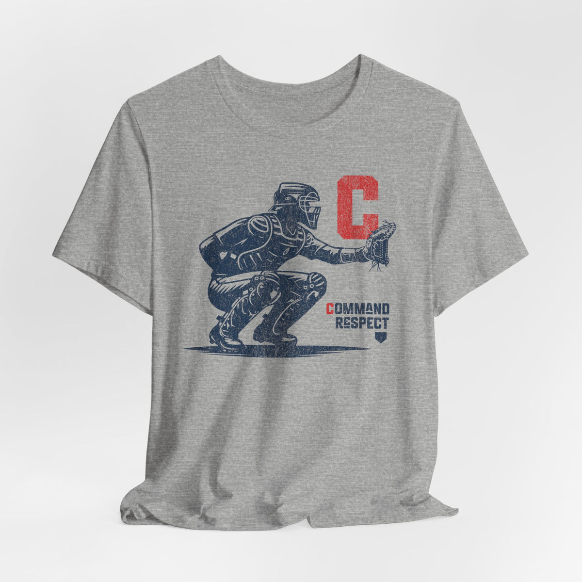 An athletic heather grey t-shirt featuring a baseball catcher and the words COMMAND RESPECT in navy, and a red letter C.