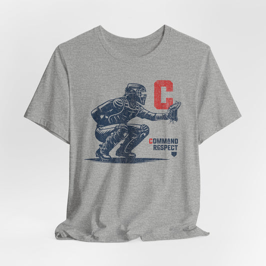 An athletic heather grey t-shirt featuring a baseball catcher and the words COMMAND RESPECT in navy, and a red letter C.