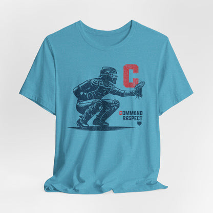 A heather aqua t-shirt featuring a baseball catcher and the words COMMAND RESPECT in navy, and a red letter C.