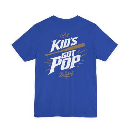 The back of a royal blue baseball t-shirt with the slogan Kid's Got Pop and a baseball bat graphic.