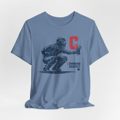 A steel blue t-shirt featuring a baseball catcher and the words COMMAND RESPECT in navy, and a red letter C.