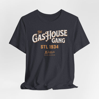 A heather navy short-sleeve t-shirt with a vintage-style graphic print reading 'The Gas House Gang STL 1934' and a small 'Artifacts Collection' logo.