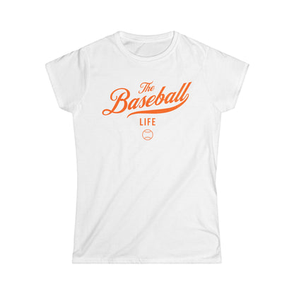 A women's white cap-sleeve t-shirt with an orange The Baseball Life logo printed across the chest.