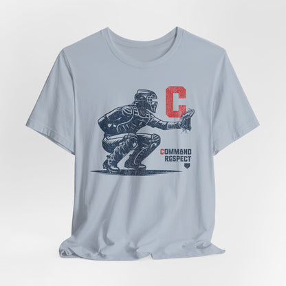 A light blue t-shirt featuring a baseball catcher and the words COMMAND RESPECT in navy, and a red letter C.