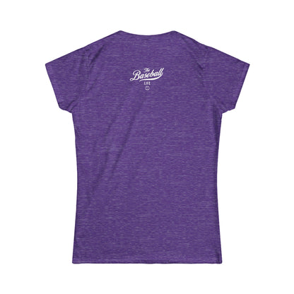 A women's heather purple cap-sleeve crewneck t-shirt shown from the back with a white graphic reading 'The Baseball Life' and a small baseball icon, displayed on a solid white background.